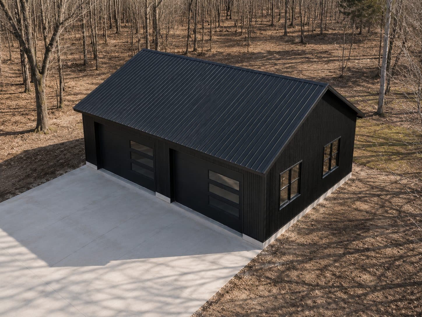 Aerial view of a 26 × 36 × 9 black steel-frame garage